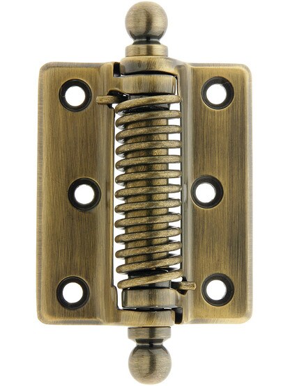 Classic Surface Mounted Screen Door Hinge With Ball Tips in Antique Brass.